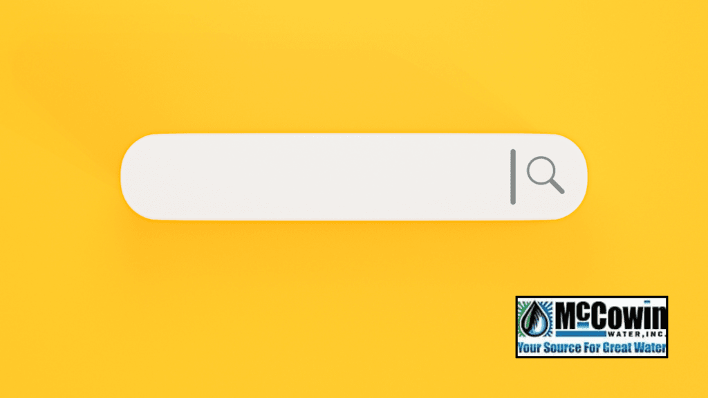 Yellow background with a blank search bar and McCowin Water logo, representing a local search for “water dispenser near me.”