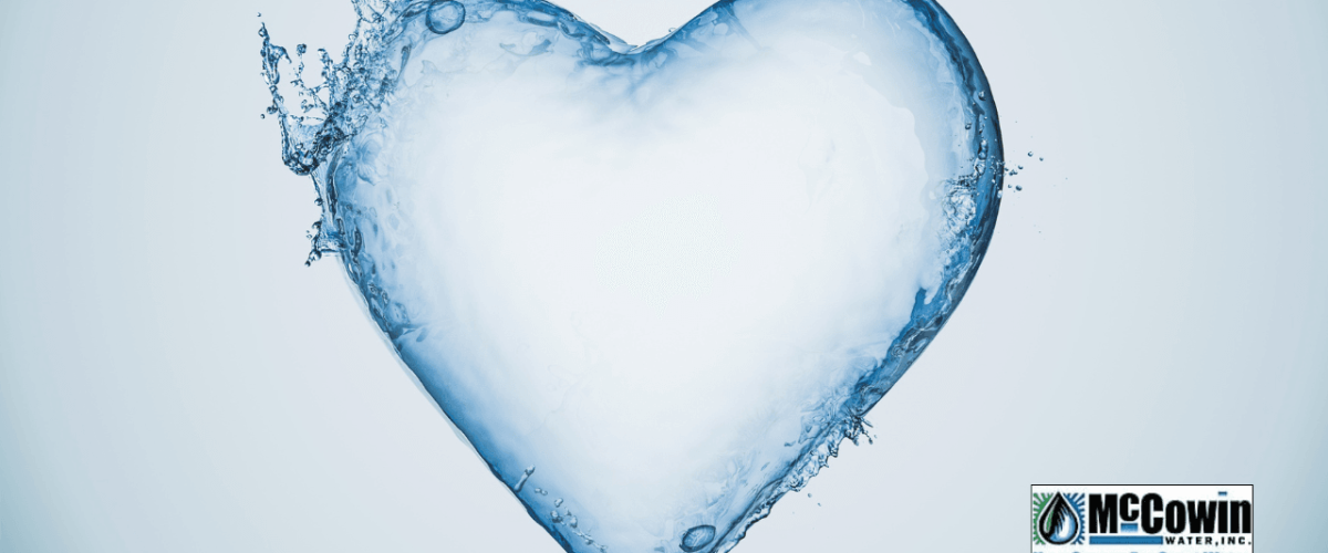 Heart-shaped splash of clean water representing the emotional and physical protection provided by reverse osmosis filtration for your family and home.