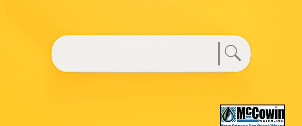 Yellow background with a blank search bar and McCowin Water logo, representing a local search for &ldquo;water dispenser near me.&rdquo;